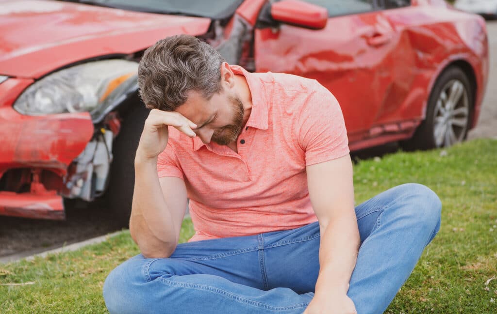 Car Crash Accident. Upset Driver After Traffic Accident.