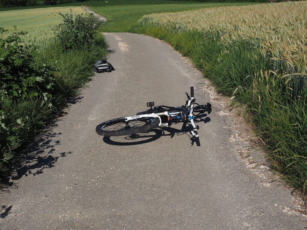 Bicycle laying on its side after accident